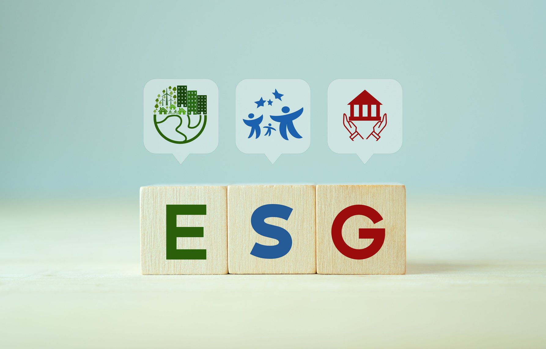 ESG concept of environmental, social and governance. Sustainable corporation development.  Wooden cubes with abbreviation ESG standing with other ESG icons on grey background, copy space. SDGs banner.